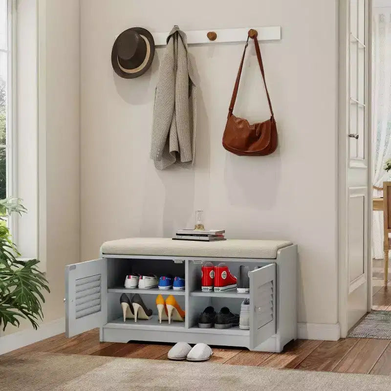 Banc meuble à chaussures avec double portes, banc d'entrée avec étagères réglables et coussins amovibles, étagère à chaussures de couloir.
