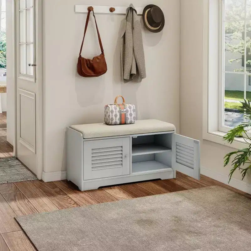 Banc meuble à chaussures avec double portes, banc d'entrée avec étagères réglables et coussins amovibles, étagère à chaussures de couloir.