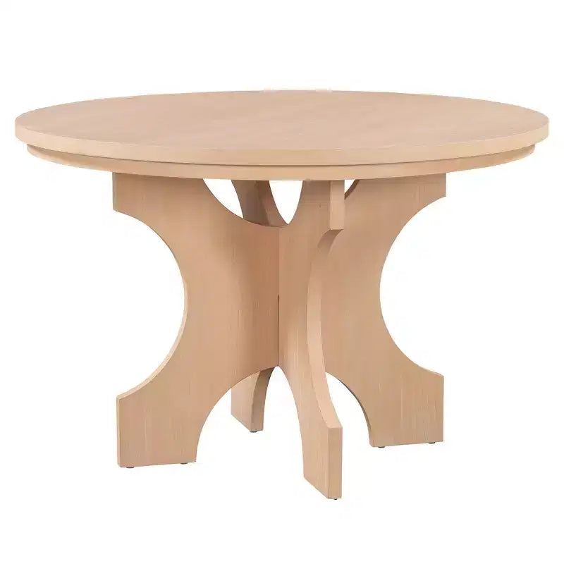 Ensemble table et chaises de salle à manger rondes de style campagnard, comprenant des chaises rembourrées et un banc incurvé.